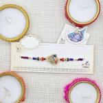 Exquisite Peacock Design Rakhi with Colorful Beads