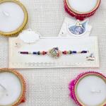 Exquisite Peacock Design Rakhi with Colorful Beads